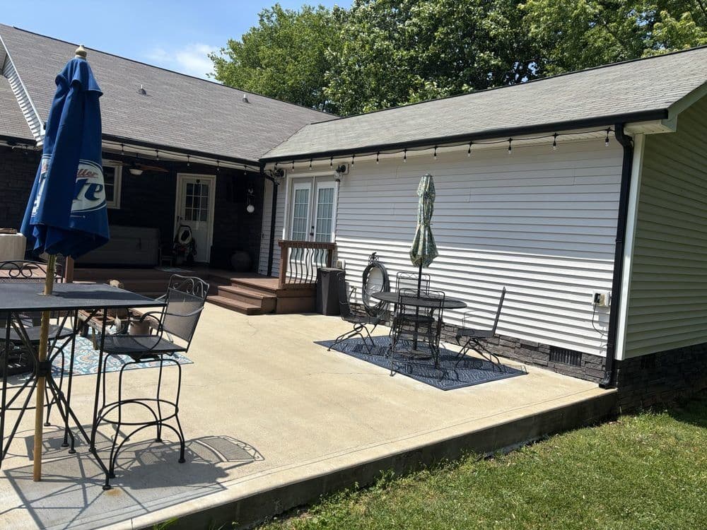 Pressure washed concrete patio and vinyl siding on a Clarksville home