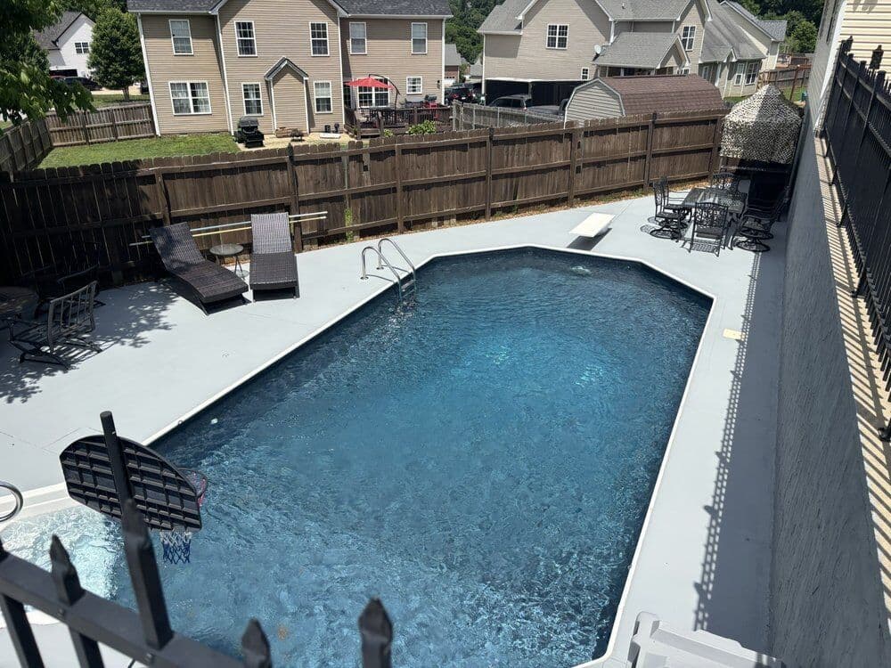 Pool deck and wall pressure washed and painted