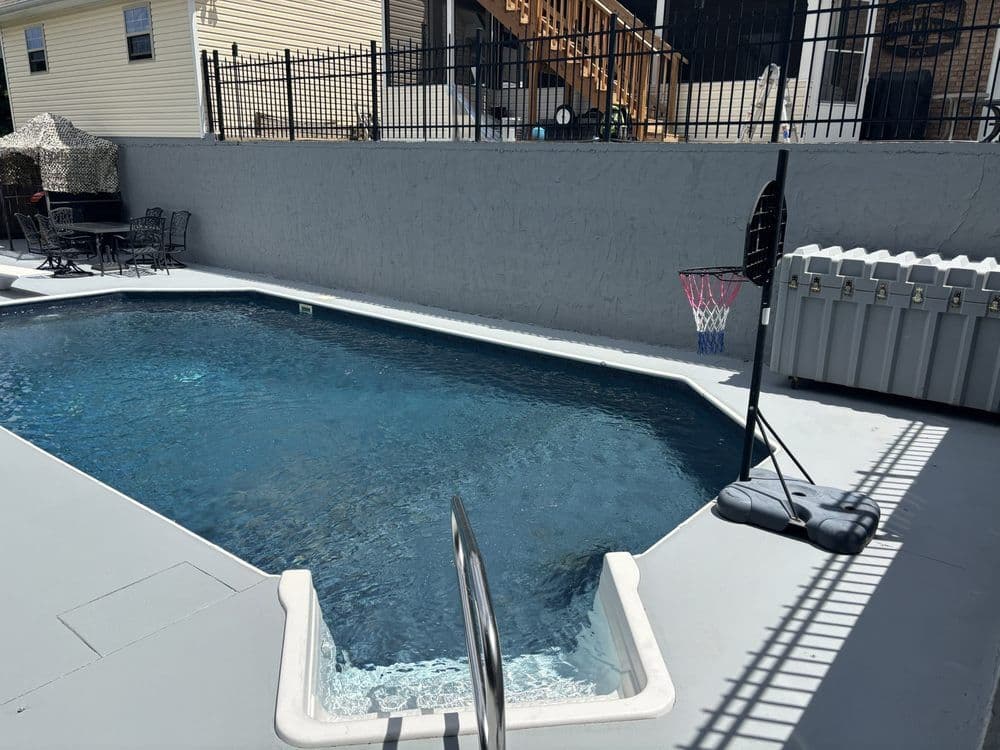 Pool deck area pressure washed and painted