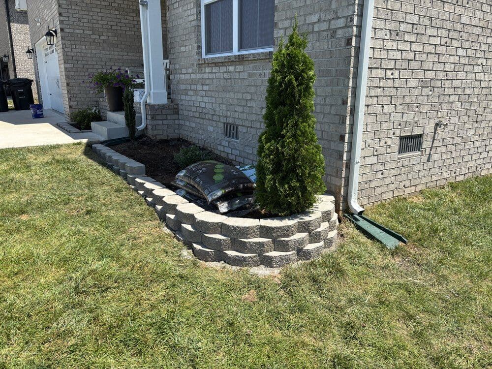 Retaining wall built around an existing flower bed